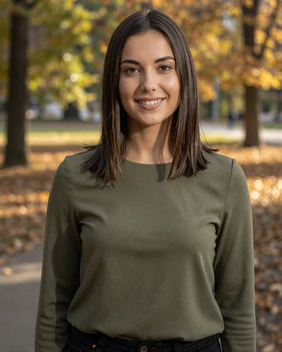 Simona, 27-year-old Slovakian woman from Bratislava with dark brown hair smiling in an autumn park