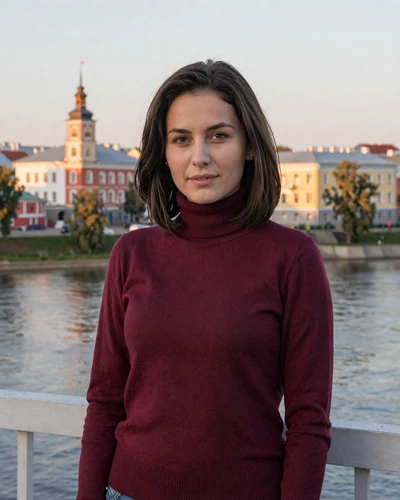 Alena, 31-year-old Belarusian woman from Vitebsk with dark brown hair on a bridge over the Dvina River