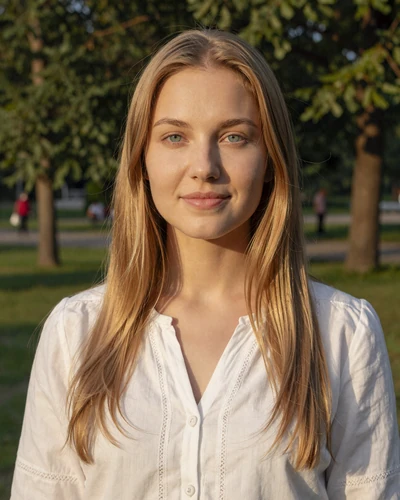 Daryna, 27-year-old Ukrainian woman from Kyiv with blonde hair in a sunlit park